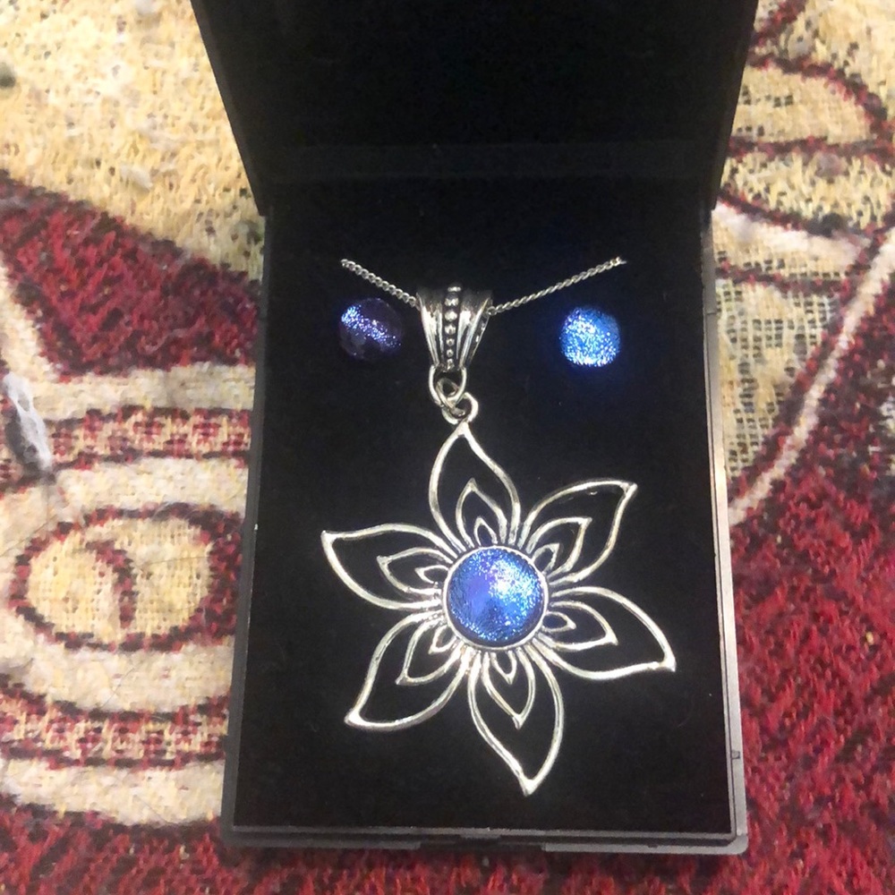 Silver flower necklace and earrings set.
